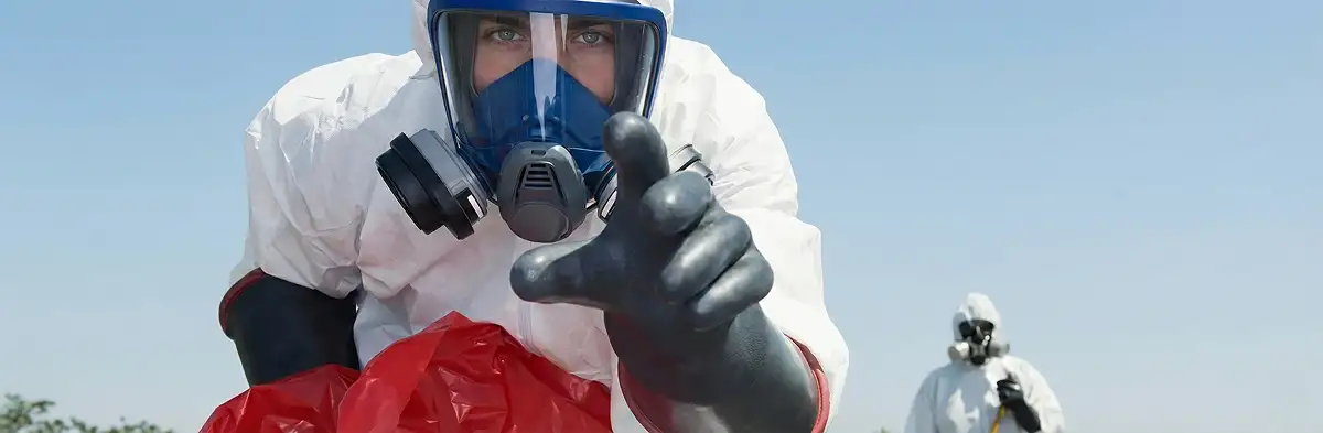 sewage clean up technician wearing protective gear handling biohazard materials in Anaheim, CA