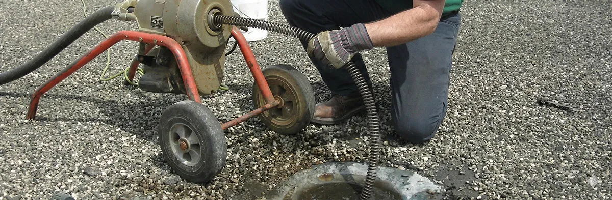 sewer rodding technician actively removing blockages from a sewer line in Anaheim, CA