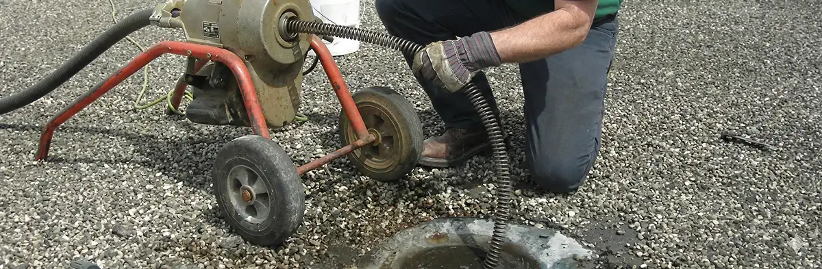 sewer rodding technician actively removing blockages from a sewer line in Anaheim, CA